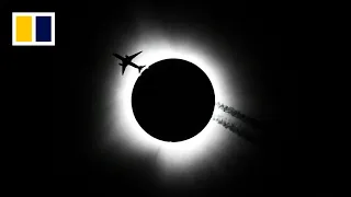 Total solar eclipse darkens North America