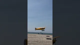 Airplanes on the sand in Huntington Beach CA. Take off and landing, fly by.