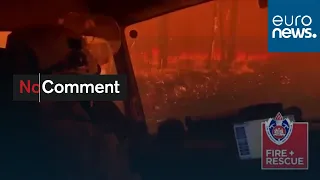 Terrifying moment as Australian firefighters drive through flames