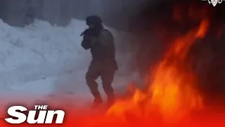 Russian soldiers run through fire in extreme military training drills