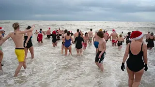 Swimmers take the plunge in Brighton for chilly Christmas Day dip