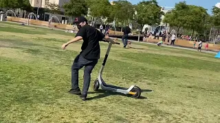 Doing a wheelie on an electric scooter