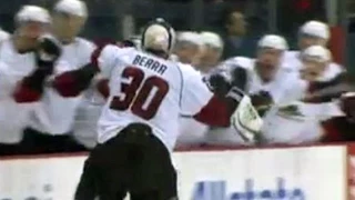 Goalie Reto Berra scores goal and celebrates