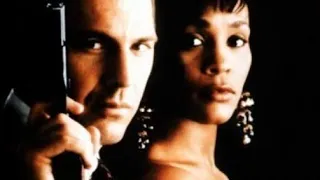 Kevin Cosner and Whitney Houston....Frank took the bullet to protect Rachel....The Bodyguard (1992).