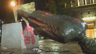 Statues toppled, windows smashed, riot declared downtown