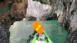 Needling a keyhole while testing a Delta 16. Lots of caves and features on this coastal paddle.