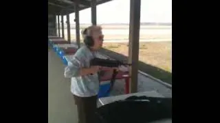 Grandma shooting machine gun