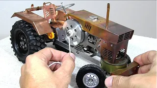 Mini tractor with an engine that swallows the fire, powered by alcohol! Isn't it a Stirling engine?