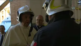 Pope Francis dons fireman's helmet to visit cathedral in Camerino