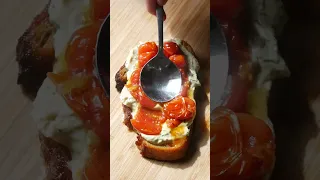 Garlic confit Spread on toast with confit tomatoes and garlic chips