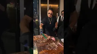 Salt bae feed a girl meat in front of her boyfriend