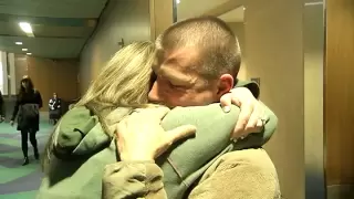 Soldier surprises wife at Portland airport