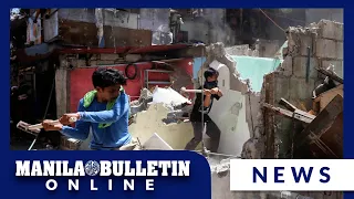 Demolition team destroys houses in Brgy. Sto. Domingo, Quezon City