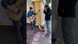 I’m busking when Jackson Browne ambles up to swap tunes and stories & gives me his cool thumbpick.