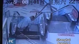 CCTV: Woman narrowly escapes as escalator floor breaks open