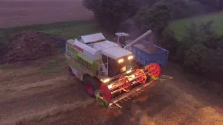 Claas mega dominator 202 harvesting at night