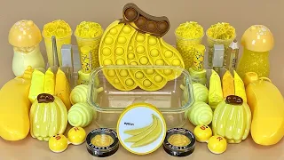 YELLOW SLIME | Mixing makeup and glitter into Clear Slime.