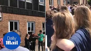 Students in Manchester sing classic Oasis song in message of hope - Daily Mail