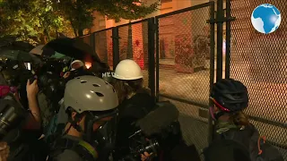 Tear gas fired as protesters try to break down courthouse fence in Portland