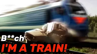 Car gets smashed by train after getting stuck on rails