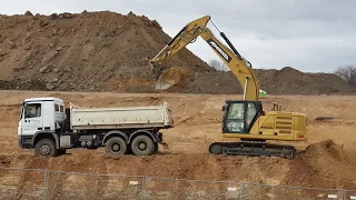 New CAT 323 wird TopCon GPS loading soil in Mercedes-Benz dump truck