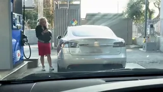 Dumb blonde brings Tesla to gas pump.