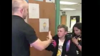 5th grade teacher does personalized handshakes with each student