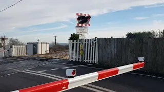 *Broken alarm, new barrier arm* Athelny crossing somerset.