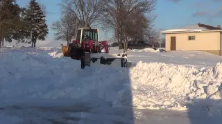 International tractor snowblowing