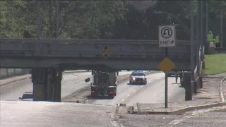 Parts of overpass crumbles in Raleigh after truck crashes into it