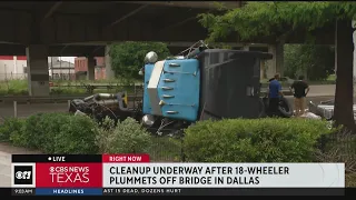 Driver in stable condition after 18-wheeler crashed, dangled off I-345 in Dallas