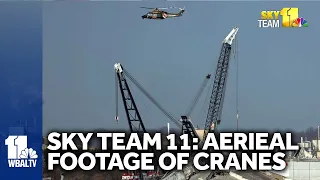 Aerial video: Cranes working on wreckage of Baltimore bridge collapse