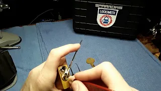 (023) American Lock 1100 Series picked that contains a Master Lock 410 LOTO cylinder/core