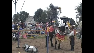 professional jouster/wrestler in knight armor does a swanton bomb off of a horse