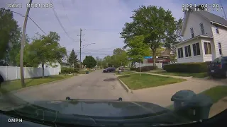 DASHCAM: Michigan police pursue stolen van through narrow residential streets on garbage pickup day