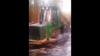 John Deere 1110 in wet forest, extreme conditions