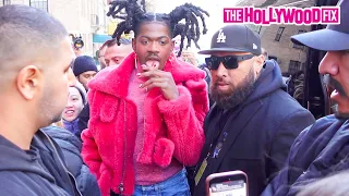 Lil Nas X Is Mobbed Hard By Fans While Sucking On A Lollipop In Pink Fur At The Coach Fashion Show