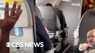 Stranger helps calm crying baby on flight