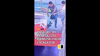 Passers-by rescue girl hanging from escalator in China #shorts