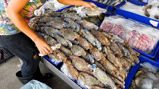 Chili crab and grilled freshwater shrimp made by a fishmonger - Thai street food