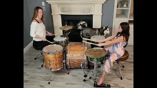 Mother daughter drum set battle using Linear Drumming.