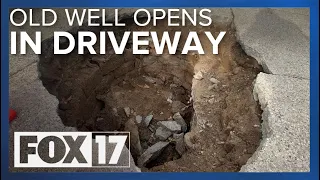 Old dry well opens in family's driveway