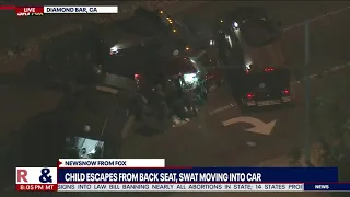 SWAT tear gases car after 3-hour chase, police pull a child & the driver out of the vehicle