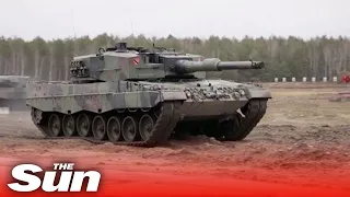 Soldiers prepare Poland's Leopard 2 tanks for the battlefield