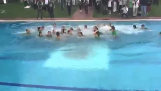 Rafael Nadal dives in the swimming pool after defeating Kei Nishikori in Barcelona