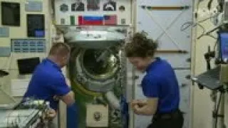 Soyuz hatch opening, welcome at ISS