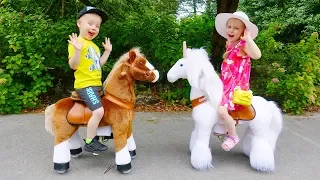 Gaby and Alex Ride on Toy Horses