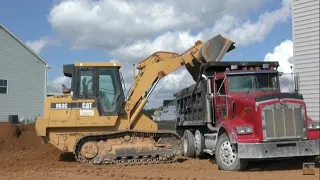 CAT 963C Loading Dirt into a Dump Truck