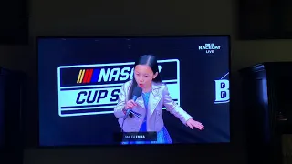 Eight year old sings national anthem at NASCAR race.