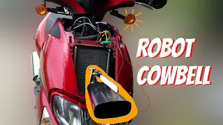 Robot that bangs a cowbell when you turn signal